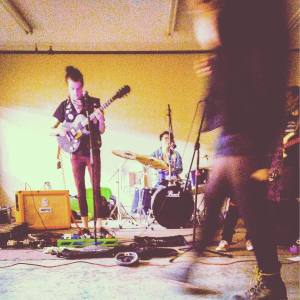 Angie playing a show. Links to contact form.